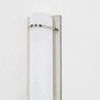 Close-up angled view showing matte glass triangle profile and metal brackets of Tottenville Wall Sconce