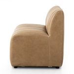 Side view highlighting smooth leather side panel and vertical channeling on seat and back