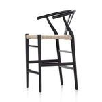 Close view of corner post on woven seat with black teak frame