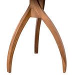 Close-up on the curved teak wood legs connecting to the table's center support structure
