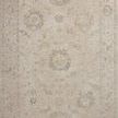 Traditional Louisa Oatmeal / Slate Rug with pale blues, creams, and browns in a muted Turkish floral design