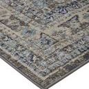 Close-up of Bellini Delphinium rug corner showing dense woven texture and detailed pattern in blue and gray tones