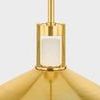 Close-up of cylindrical alabaster diffuser encased in polished brass frame above tapered brass shade