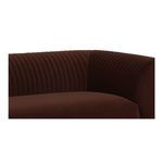 Close-up of the corner where backrest meets armrest, focusing on soft velvet texture and channel tufting