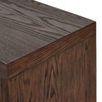Oblique front view highlighting black matte cylindrical hardware on sideboard doors