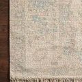 Priya Natural / Blue Rug with tonal floral pattern in soft blues and neutrals, hand-woven texture and fringed edge