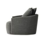 Front angle of chair showing low arms, wide seat cushioning, and two large pillows