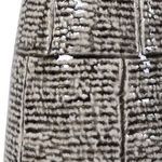 Extreme close-up of Zoe Table Lamp’s glazed ceramic base with detailed textured pattern