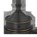 Close-up of lamp base showing on/off button and bronze trim
