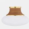 Close-up of aged brass canopy and rattan-wrapped fitter on Pearl River flush mount ceiling light