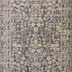 Traditional power-loomed area rug with a blue and beige floral design and a classic bordered pattern