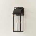 Bohen sconce angled view on light wall highlighting candle bulbs and clear glass panels