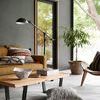 Elliot Granite Rug in modern living room with tan sofa, wooden coffee table, floor lamp, and large window