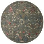 Round version of the Giada Lagoon rug showcasing full floral pattern and muted colors