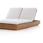 Angled view focusing on the teak base grain and wide stone grey cushions with elevated backs