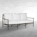 Roma Aluminum Outdoor Sofa with white plush cushions, black aluminum frame, and brass accent finials