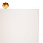 Close-up of the white drum lampshade with gold leaf ball finial on top