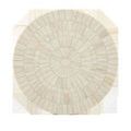 Top-down view of Osa Drinks Table’s surface showcasing circular concentric bone tile arrangement