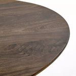 Top corner close-up emphasizing wood grain pattern and finish on rounded edge of tabletop