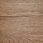 Close-up of Bennett Chair's solid oak wood grain texture on backrest and arm rail