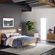Deco Natural Rug in bedroom setting beneath wooden bed frame, side tables, and dressers with dark floor and walls