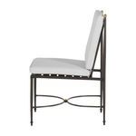 Side view of Roma chair showing cushion and frame profile with gold accent