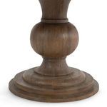 Detailed close-up of the stepped circular base and bulbous middle portion of the pedestal