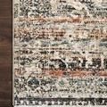 Close-up of Theia Taupe Multi Rug corner showing detailed texture and refined fringe border on dark hardwood floor