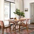 Heidi Spice Aqua Rug styled under a wooden dining table with chairs in a bright room with curtains