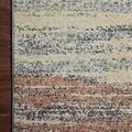 Close top-down corner showing grey binding and rug surface texture against wood floor.