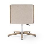 Rear view of chair showing full upholstery on backrest and height adjustment lever on swivel base
