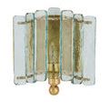 Golden metal ball and supporting arms beneath textured glass panels on wall sconce