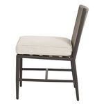 Side profile of Pietra Armless Dining Chair highlighting seat cushion thickness and frame details