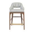 Straight-on view showing balanced proportions of padded backrest and brass footrest