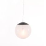 Sutton Pendant illuminated, showing soft glow through frosted glass globe