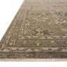 Close-up angled view showing rug’s textured weave and short fringe on edge