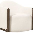 Cora Swivel Chair with rounded back, ivory fabric upholstery, and dark wood trim on sides and base