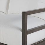 Corner close-up showing tight upholstery stitching and cushion foam density