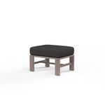 Laguna Ottoman with driftwood-look aluminum frame and dark cushion in a modern square design