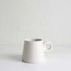 White ceramic Jerry Double Wrap Handle Mug with speckled texture and unique double wrap handle design