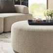 Close-up of Nest Modular Sectional Ottoman with black tray and glassware styling in living room