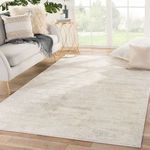 Paxton Abstract Gray/Ivory rug placed in a modern living room setting with sofa and side table