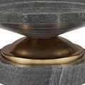 Close-up of black stone base with visible horizontal striations and brass ring at bottom