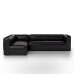 Front view showing leather sectional with subtle texture and crisp edges
