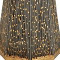 Close-up of accent table base showing black vertical filigree slats overlaying gold underlayer with worn, textured patina