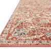 Low-angle close-up showing rust edging and detailed pile texture of the rug