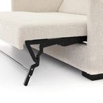 Close detail of black metal sleeper mechanism arm holding mattress frame