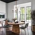 Brooklyn Dining Table displayed in modern dining room setting with surrounding chairs and natural light