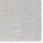 Detailed view of rug surface highlighting striped pattern variations and subtle color shifts