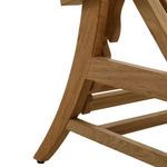 Profile close-up showing curve of chaise leg and cross braces